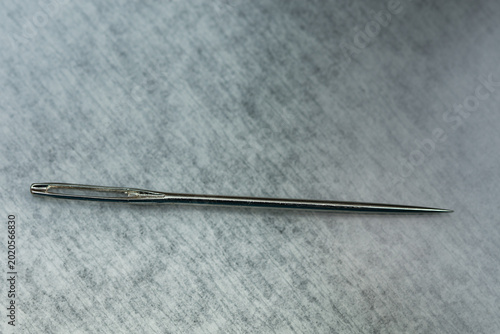 Hand sewing needle is made of hardened steel and has a sharp point suitable for fine embroidery. It is designed with a symmetrical, often large eye to facilitate the passage of embroidery threads or w