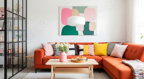 Modern living room interior with orange sofa and abstract wall art