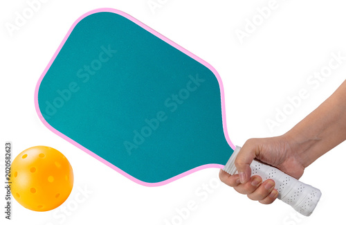 Hand holding green pickleball paddle and ball isolated on white background with work path, Pickleball paddle and ball. Concept of trending sport, active lifestyle, and fitness exercise, PNG File.