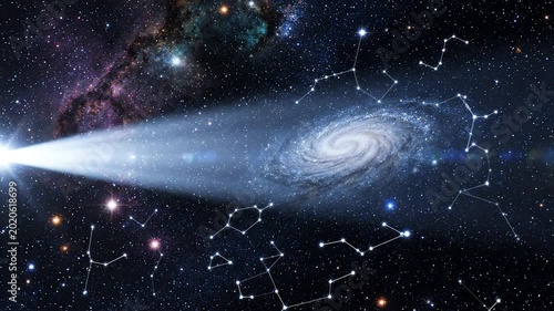 Luminous searchlight beam scanning across a deep blue starry sky with clear constellations and distant galaxies in the darkness