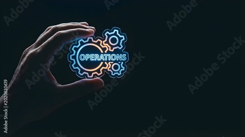 Hand holding glowing gears with operations text in futuristic blue and orange design