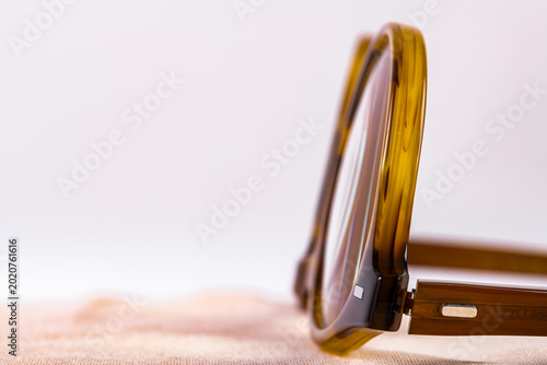 Canvas Print Detailed closeup side view of vintage reading glasses, frame design and lens detail
