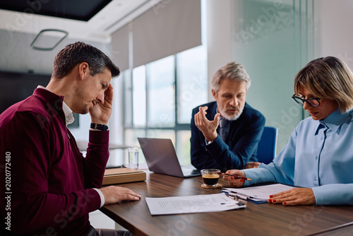 Fotografia Job candidate feeling uncertain during recruitment interview in office