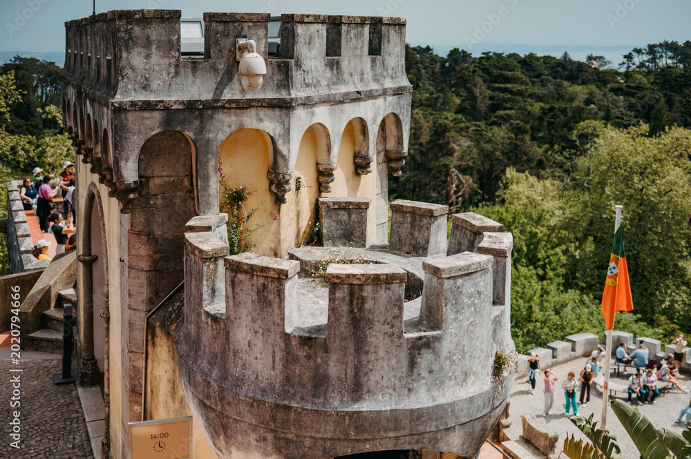 Fototapeta premium Historic turret and terrace with visitors at Pena Palace in Sintra