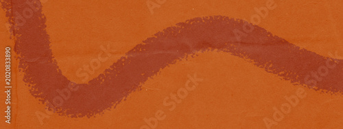 Schilderij op canvas Bold dark red wavy brush stroke on vivid orange paper texture background, hand-p