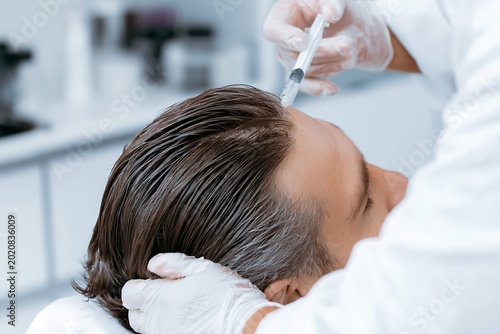 doctor performing PRP hair treatment injection on scalp, modern clinic environment, medical aesthetic concept
