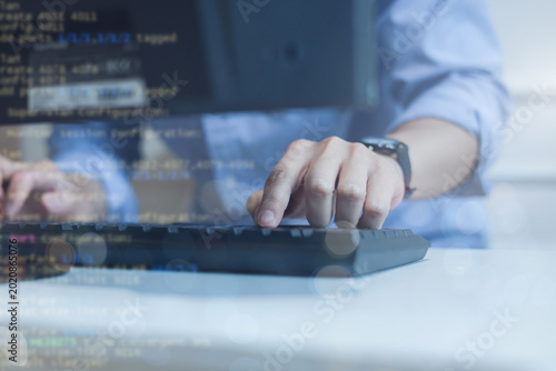 Fotografie close up computer programmer man hand typing configuration on keyboard at laptop