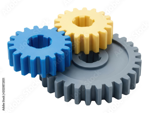Colorful blue yellow and gray plastic gears mesh together for synergy isolated transparent background image