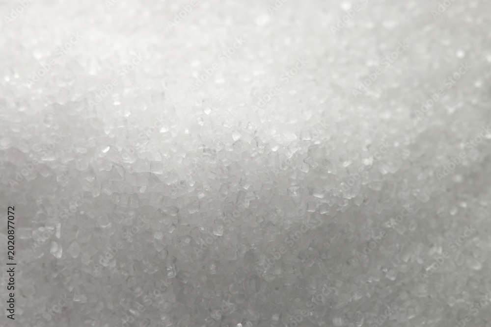 Φωτογραφία White granulated sugar, close-up shot, background and texture.