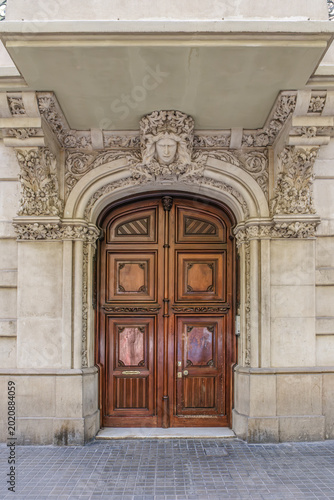 Ornate Modernist Wooden Door, Sculpted Stone Arch, Barcelona, Catalan Modernism Architecture