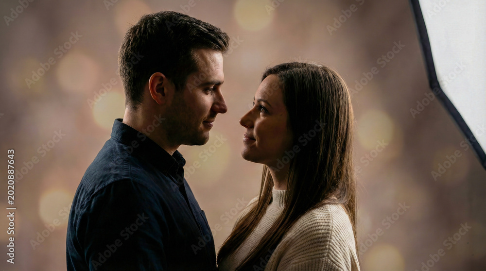 Obraz premium Photorealistic romantic couple portrait, dramatic studio lighting, emotional expressions, soft background