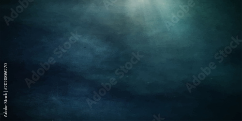 A dark blue background of stormy night sky and deep sea water features motion texture with clouds, smoke, and light rays piercing through misty fog and rain