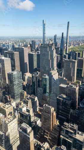 Wide view of the skycrapers in North Manhattan with blue sky