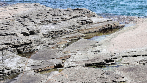 Bilde på lerret Prehistoric Coastal Geologic Formations Revealing Ancient Earth History and Sedi