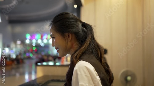 Female employee is working at cinema complex during. Occupation, part time jobs.