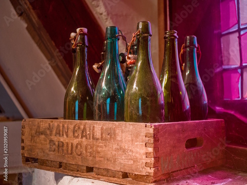 An old crate of bottles in a colourful setting