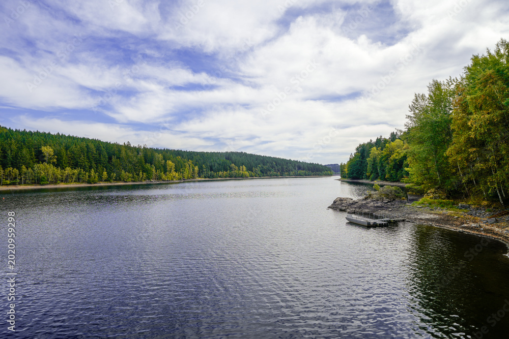 Fototapeta premium View of the Werda Dam near Falkenstein and the surrounding landscape. Nature near Werda in the Vogtland District. 