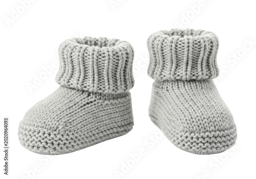 A pair of soft, grey knitted baby booties isolated on transparent background