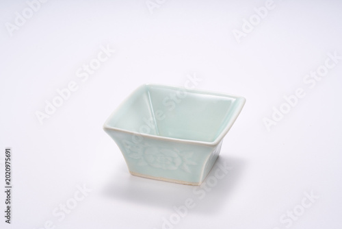 Fotografi Close-up of Chinese style ceramic texture rice bowl with square flower pattern o