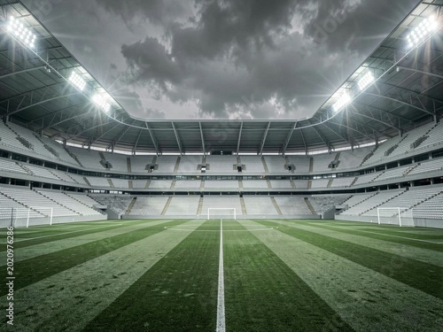 Empty Stadium Pitch Under Dramatic Overcast Sky