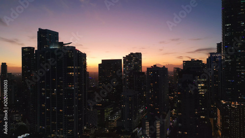 Miami city skyscrapers against a colorful twilight sky