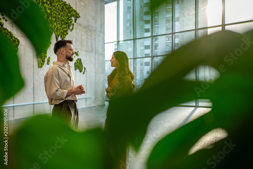 Business people networking with world map background in eco office