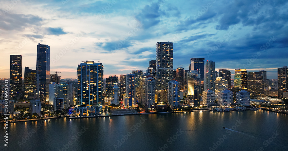 Fototapeta premium Miami cityscape reflecting urban skyline at dusk