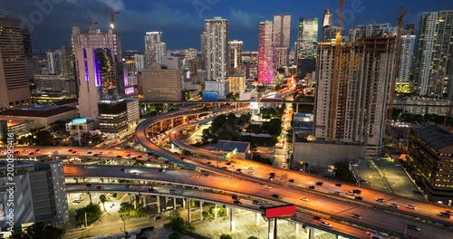 Obraz na plátně Miami downtown city skyline with highway interchange at dusk