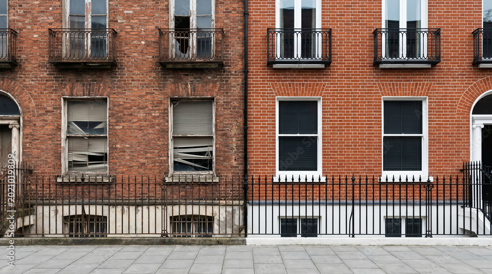 Naklejka premium Urban Brick Building Facade Before and After Renovation