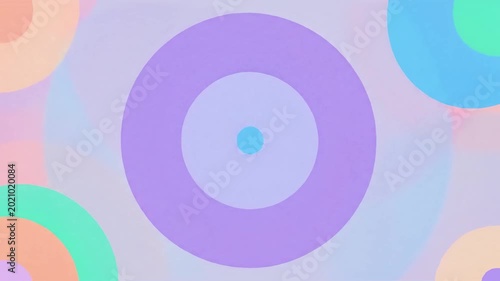 Soft pastel concentric circles and rings in purple, teal, peach and blue on a textured background, minimal abstract graphic.