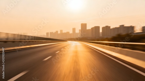 Highway leading to city skyline at sunset