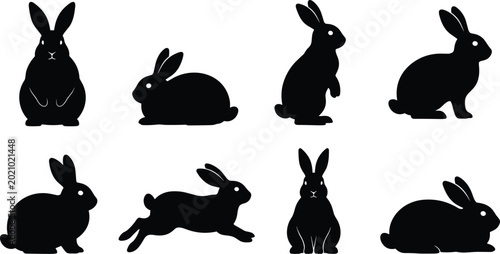 Photography Set of eight black silhouettes of rabbits in various poses, including sitting, standing, and leaping, isolated on a white background