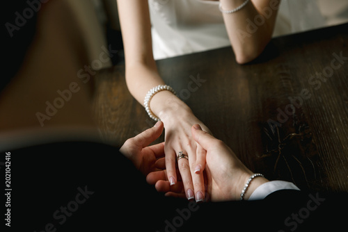 fingers hands ring bridal gown table bracelet jewelry