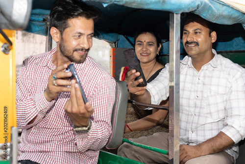 Canvastavla Indian couple making an online payment using app - payment bar code, bar code scanner, transportation, Delhi auto fare