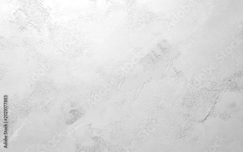 Fotografía Gray white cement rough plaster wall texture background with subtle concrete surface details, neutral minimalist wallpaper