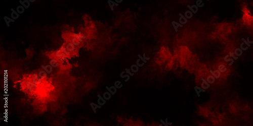 Abstract grunge red and black powder explosion cloud on black background. dark red smoke Like cloud wave effect on black. dark fire flame grunge texture background. toned fiery red sky.