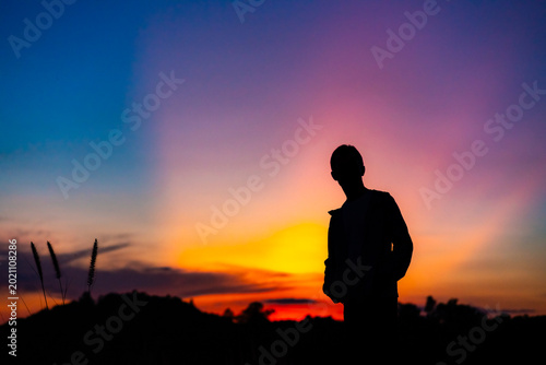 A silhouette image against the backdrop of an evening sky during sunset.