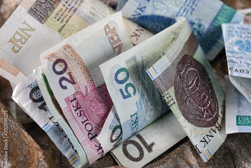 Photos A pile of bent, mixed-up banknotes of various denominations from Poland
