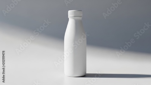 Simple white bottle on a white surface, lit by sunlight