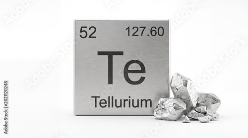 Shiny metallic tellurium element block with crystal ore samples shown in this clear studio photograph on white background