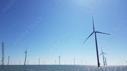 Water texture, wind turbines produce energy in the north sea, wind farm power plant view from height, green energy and alternative energy sources, windmill.