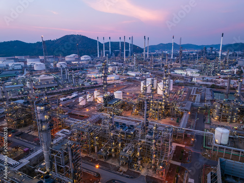 Industrial Petrochemical Refinery Facility Illuminated Under Vibrant Purple Twilight Sky