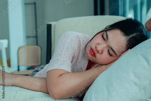Canvastavla Woman is taking nap soundly during the day to relax at home daydreaming and resting on a comfortable sofa in the air conditioned guest room which helps her sleep better