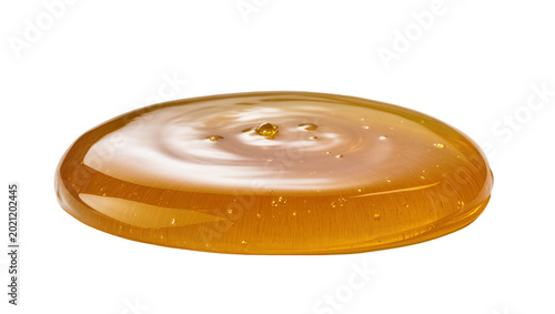 Valokuva Golden viscous honey puddle with ripples, isolated on transparent background