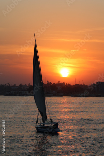 Photos Traditional Felucca Sailboat on the Nile at Golden Sunset