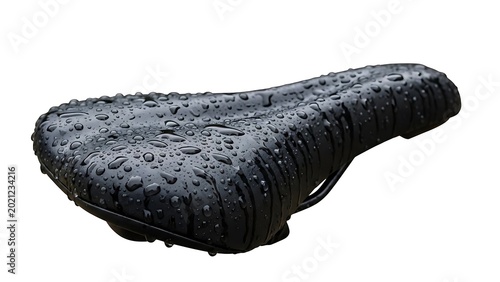 Black bicycle saddle seat covered in many small water droplets isolated on a white background with textured equipment transport moisture component isolated background exercise