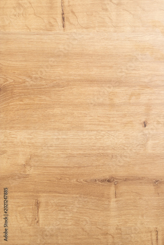 Natural oak tabletop background with warm brown tones, subtle grain and knots. Wooden surface ideal for product photography, design mockups, interior projects, rustic themes and backgrounds.