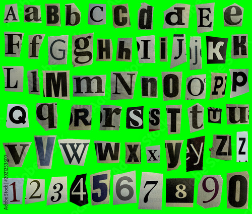 Collage ransom full alphabet of uppercase and lowercase letters, digit numbers cut out from newspapers on a green background, black and white brown retro vintage style. Newspaper letters for blackmail