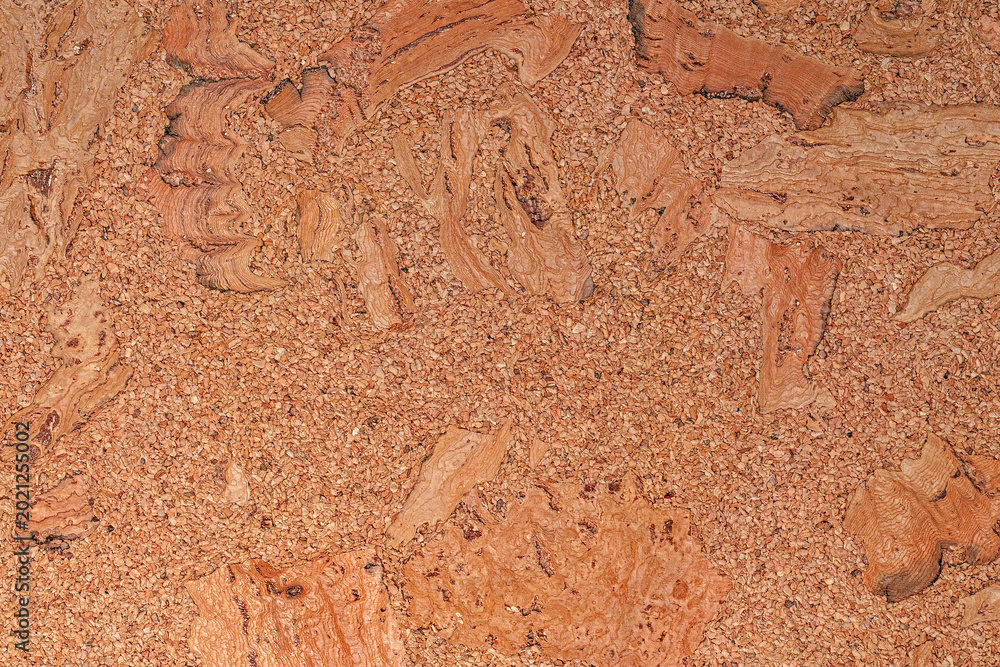 Fototapeta premium Brown corkboard texture with organic pattern. Close-up of natural granulated cork material background.