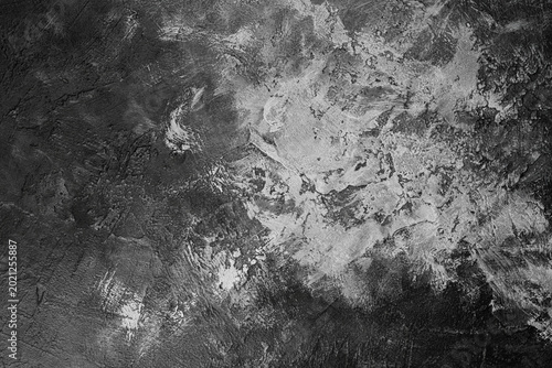 Grunge black and white cement background with rough surface.